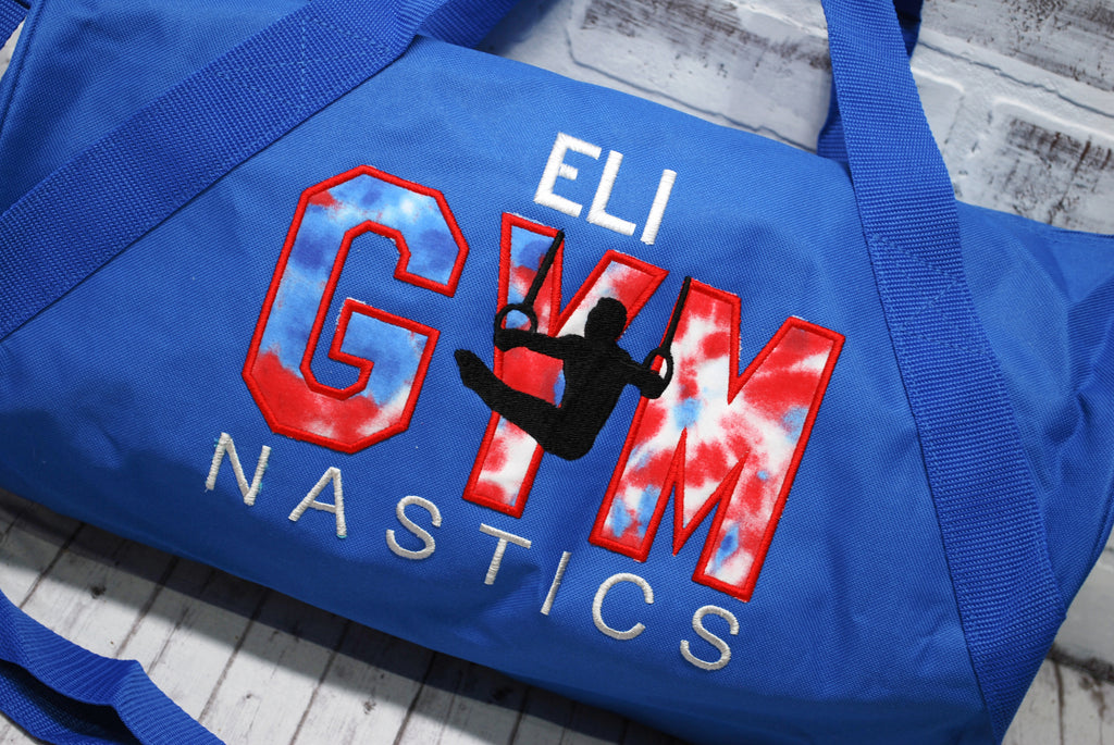 Red white and blue gymnastics duffle bag for boys.
