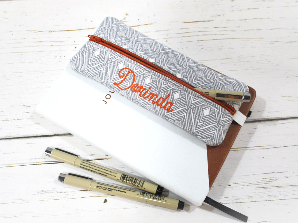 Simple gray geometric planner pouch with orange